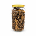 Dried morel mushrooms (Morchella esculenta) in a clear glass jar with a yellow lid