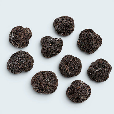 Individually quick-frozen whole black truffles with light natural frost