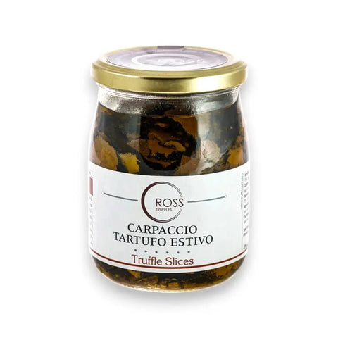 Jar of truffle carpaccio with extra virgin olive oil and gold lid labeled carpaccio tartufo estivo